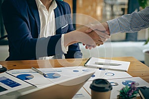 Business people meeting in modern room Hand in hand for business success Employees shake hands with each other, brainstorming for