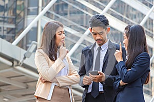 Business people meeting and sharing ideas, Young Asian business team discussing in the morning