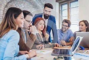 Business people meeting to discuss ideas in modern office