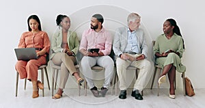 Business people, networking and waiting room in line for recruiting or hiring meeting on chair at office. Diversity or