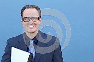 Business, people and office concept - happy smiling businessman with glasses in suit