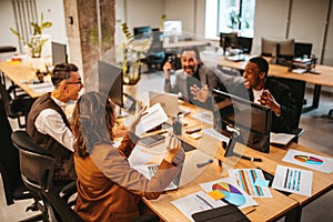 Business people in office work together during a meeting