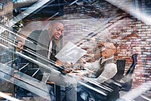 Business people in office work together during a meeting