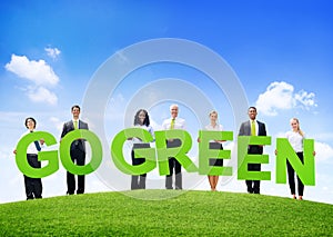 Business People Outdoors Holding Texts Go Green