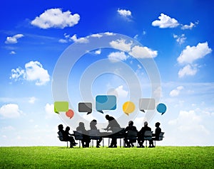 Business People Outdoors Work Around The Conference Table
