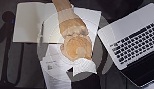 Business people of a Partnership Team Giving Fist Bump after complete deal. Successful Teamwork Partnership in an Office