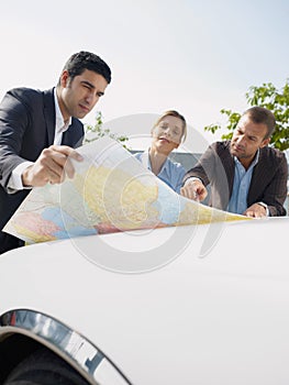 Business People Planning Car Trip Consulting Map For Directions