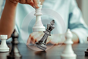 Business people are planning marketing strategies by analyzing the mechanisms and probability of the market by using chess to work