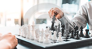 Business people are planning marketing strategies by analyzing the mechanisms and probability of the market by using chess to work