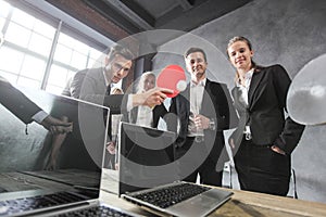 Business people play ping pong