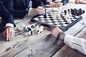 Business people playing chess