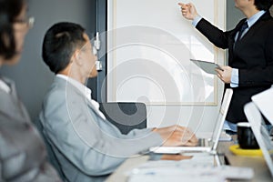 Business people present business ideas to the team while meeting in the office, business concept