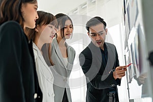 Business people proficiently discuss work project while sitting in circle