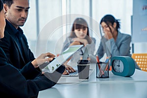 Business people proficiently discuss work project while sitting in circle