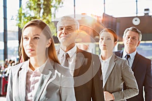 Business people queueing for check in airport photo