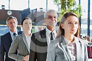 Business people queueing for check in airport photo