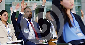 Business people raising their hands in a business seminar 4k