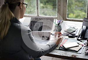 Business people Reading Newspaper at Office Updating News
