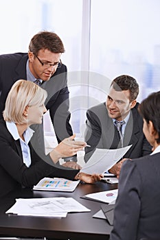 Business people reviewing contract