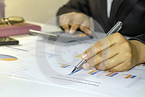 Business people reviewing reports, financial documents for analysis of financial information