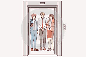 Business people ride in elevator together, going up to another department of corporation