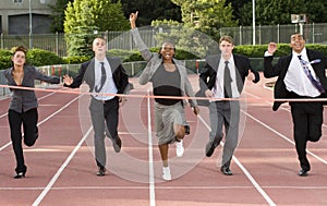 Business People Running Across the Finish Line