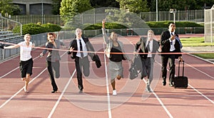 Business People Running Across the Finish Line