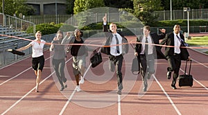 Business People Running Across the Finish Line