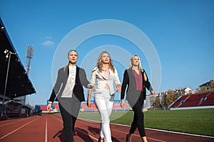 Business people running on racing track