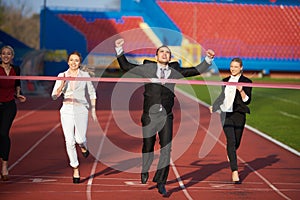 Business people running on racing track