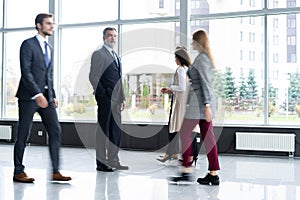 Business people rushing in the lobby. motion blur.