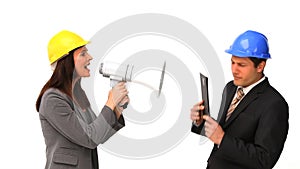 Business people with safety helmets and megaphone