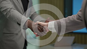 Business people shacking hands together showing successful contract agreement