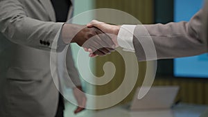 Business people shacking hands together showing successful contract agreement