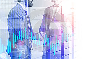 Business people shake hands, blue graph