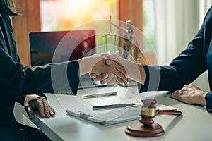 Business people shake hands to make an agreement male judge legal advisor A court litigation planning service contract after co-op