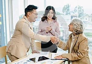 Business people shaking hand for a complete business deal together successful, finishing up a meeting.Partnership concept and