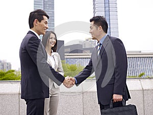 Business people shaking hands