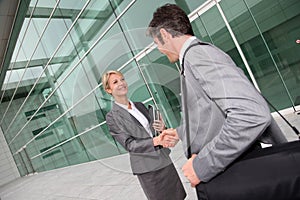 Business people shaking hands and closing the deal