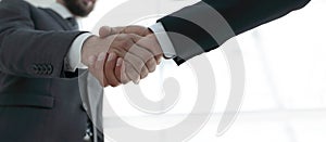 Businessmen making handshake - business etiquette, congratulatio