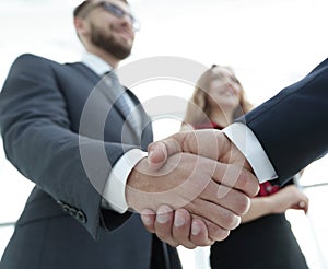 Businessmen making handshake - business etiquette, congratulatio