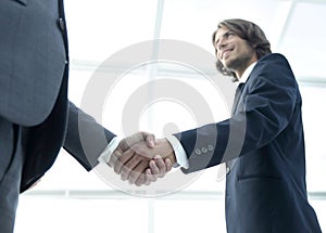 Businessmen making handshake - business etiquette, congratulatio