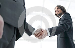 Businessmen making handshake - business etiquette, congratulatio