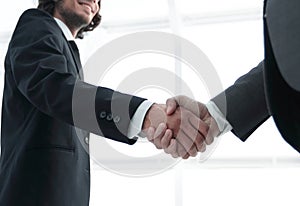 Businessmen making handshake - business etiquette, congratulatio