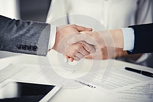 Business people shaking hands finishing contract signing, close-up. Business communication concept. Handshake and