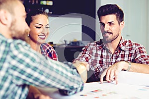 Business people shaking hands, finishing up a meeting