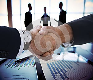 Business people shaking hands, finishing up a meeting