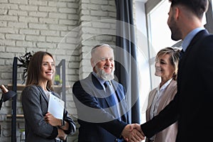 Business people shaking hands, finishing up a meeting