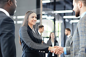 Business people shaking hands, finishing up a meeting