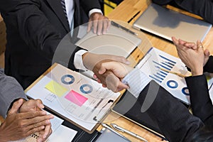 Business people shaking hands after finishing up a meeting. Businessman handshaking after conference. teamwork, partnership, coll